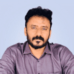  A man with a beard and mustache, wearing a purple shirt, stands confidently against a light blue background, embodying the modern essence of MxDR innovation.