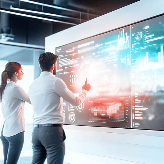  A person is deeply engaged in their work at a desk, surrounded by multiple monitors displaying various SecOps dashboards, all powered by a state-of-the-art laptop in an office setting.