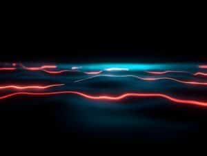 Abstract digital image featuring glowing red and blue lines curving across a dark background, evoking light trails or waves in a futuristic landscape—visually mirroring the ever-evolving ransomware trends and TTPs in cybersecurity.