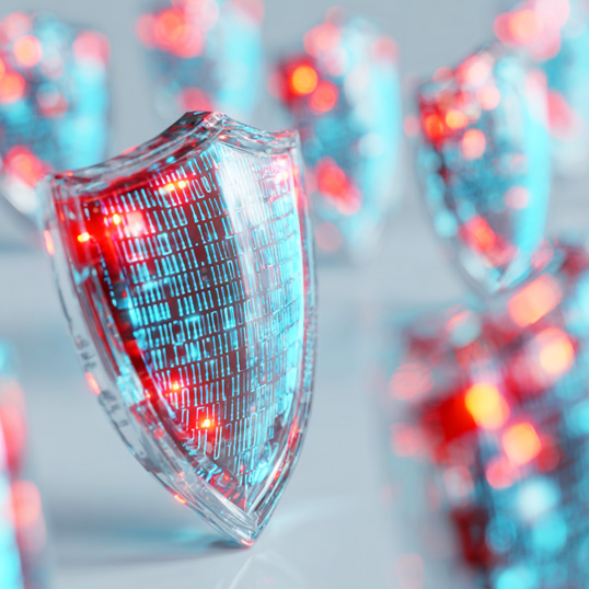  A digital shield with binary code and glowing red and blue lights, highlighting cybersecurity or data protection amid a growing Security Skills Gap.